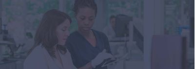 two scientists in hospital lab looking for accreditation 