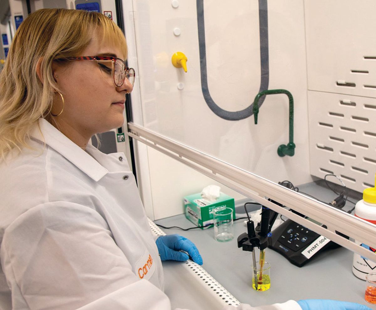 USP staff member work in a fume hood. USP staff member work in a fume hood.