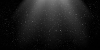 Particles floating on a black background