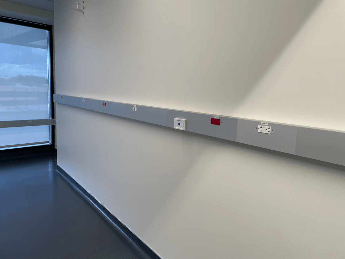Power raceways running along the wall of a lab Power raceways running along the wall of a lab
