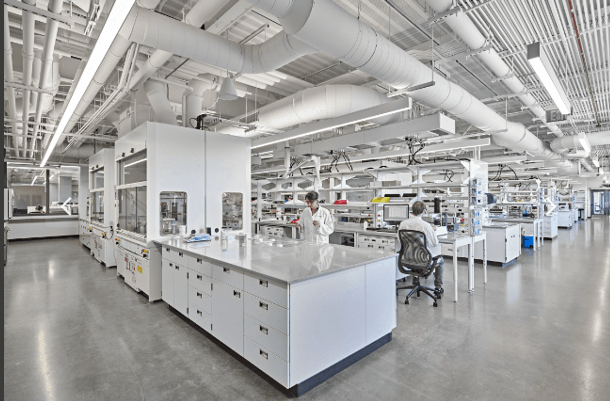 Image of a spacious lab with rows of benches Image of a spacious lab with rows of benches
